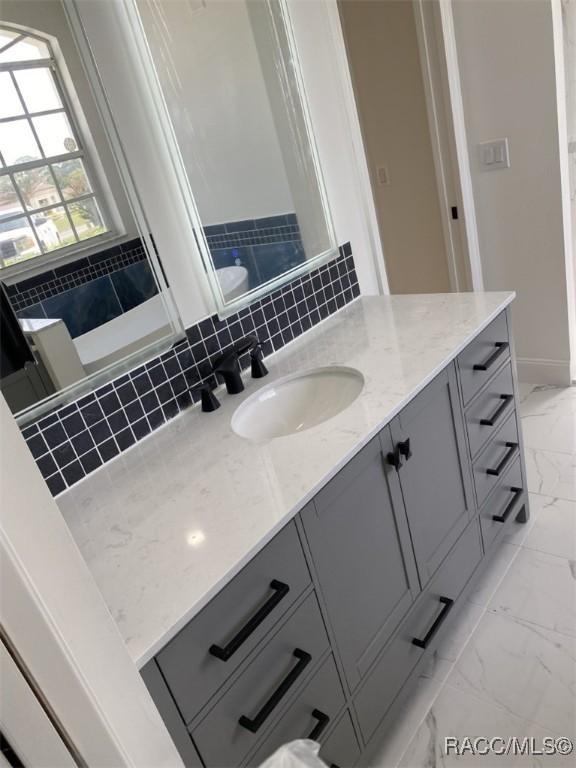259 N Cherry Pop Dr, Inverness, FL 34453 - full bath with marble finish floors and vanity