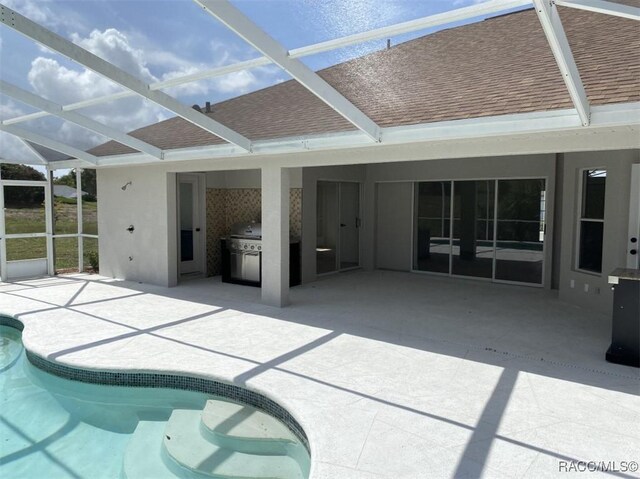 259 N Cherry Pop Dr, Inverness, FL 34453 - swimming pool featuring exterior kitchen, a patio, and a lanai