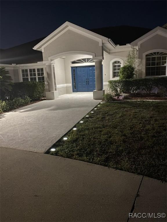 259 N Cherry Pop Dr, Inverness, FL 34453 - single story home featuring stucco siding and french doors