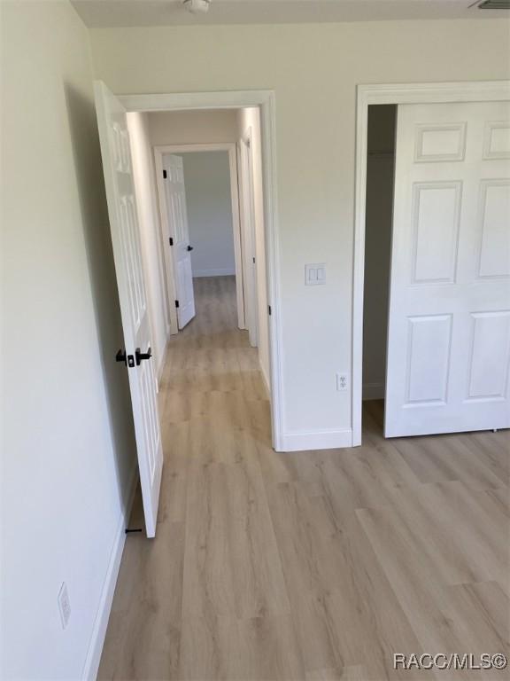 259 N Cherry Pop Dr, Inverness, FL 34453 - hall with baseboards and light wood finished floors