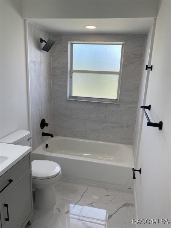 259 N Cherry Pop Dr, Inverness, FL 34453 - bathroom with vanity, toilet, tub / shower combination, marble finish flooring, and recessed lighting