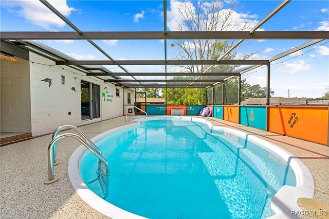 view of swimming pool with a lanai