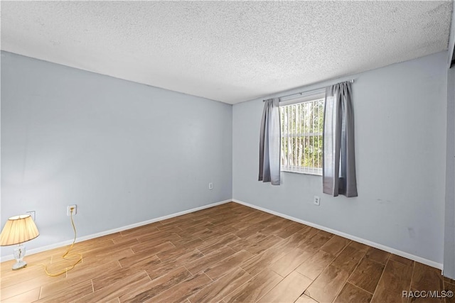 spare room featuring a textured ceiling