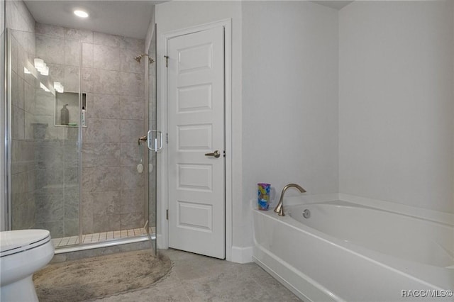 bathroom with tile patterned floors, a shower stall, toilet, and a bath