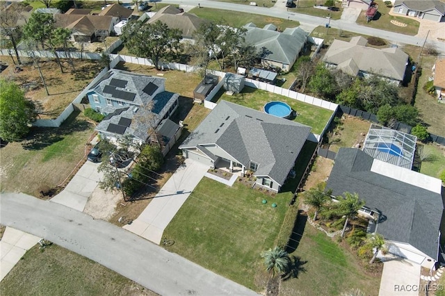 birds eye view of property with a residential view