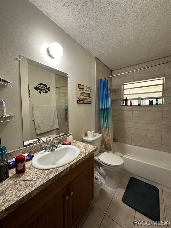 full bathroom with vanity, shower / bath combination with curtain, tile patterned flooring, toilet, and a textured ceiling