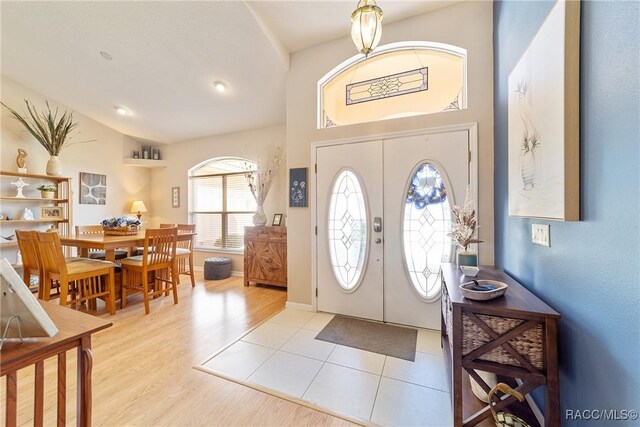 bedroom featuring multiple windows, access to outside, ceiling fan, and light hardwood / wood-style floors