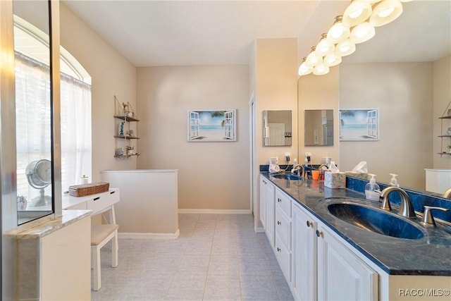 bathroom with tile patterned flooring and vanity