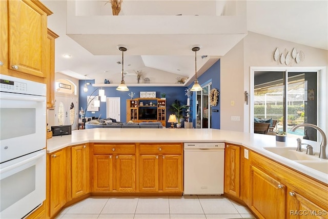 kitchen featuring kitchen peninsula, lofted ceiling, decorative light fixtures, white appliances, and light tile patterned flooring