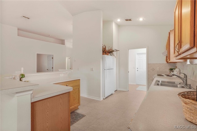 2459 N Brentwood Cir, Lecanto, FL 34461 - kitchen with freestanding refrigerator, light countertops, decorative backsplash, light flooring, and recessed lighting