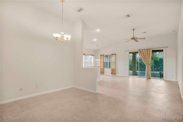 2459 N Brentwood Cir, Lecanto, FL 34461 - empty room with a chandelier, healthy amount of natural light, lofted ceiling, and ceiling fan
