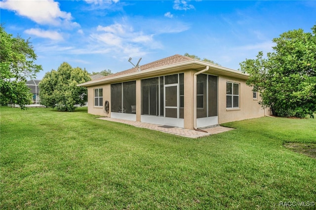 2459 N Brentwood Cir, Lecanto, FL 34461 - rear view of property with a lawn, a sunroom, and stucco siding