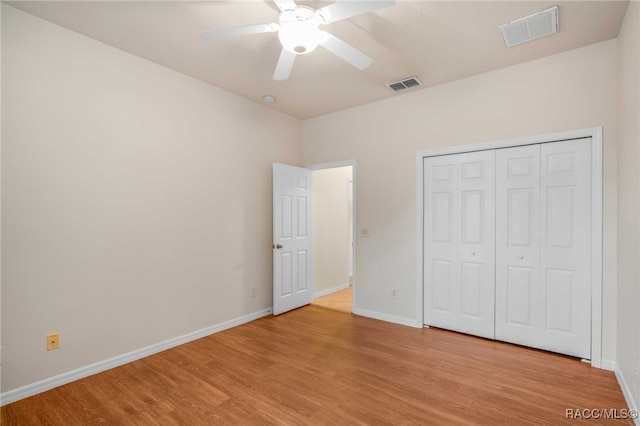 2459 N Brentwood Cir, Lecanto, FL 34461 - unfurnished bedroom with light wood-type flooring, a closet, and a ceiling fan