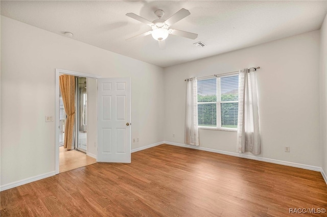 2459 N Brentwood Cir, Lecanto, FL 34461 - empty room with light wood-style flooring and ceiling fan
