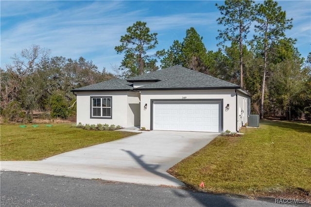 view of front of home with a garage and a front yard