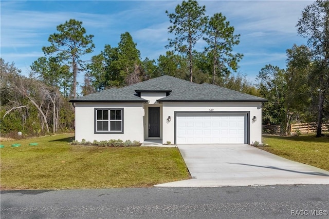 view of front facade featuring a garage and a front yard