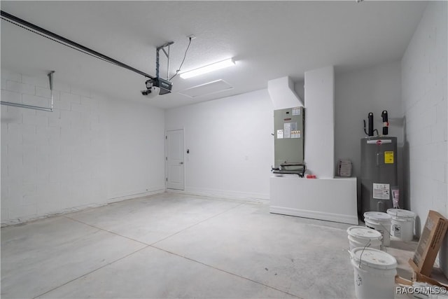 garage with heating unit, a garage door opener, and electric water heater