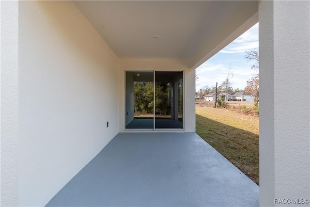 exterior space featuring a lawn and a patio area