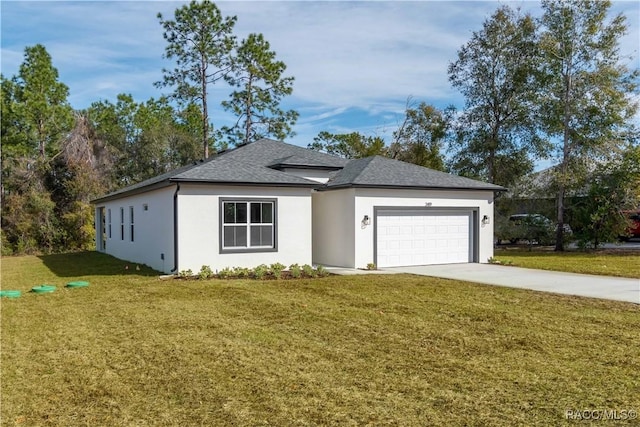 view of front of property with a garage and a front yard