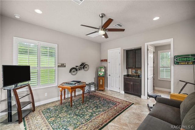 living room with ceiling fan