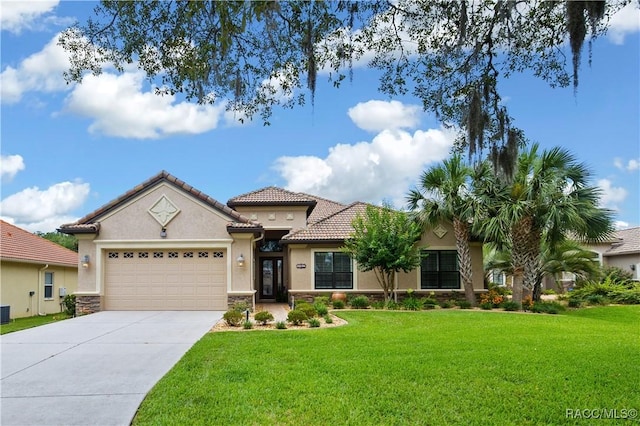 1462 N Ridge Meadow Path, Hernando, FL 34442 - mediterranean / spanish house featuring an attached garage, stone siding, a front lawn, and concrete driveway