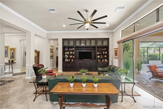 tiled living room with ceiling fan, ornamental molding, and a textured ceiling