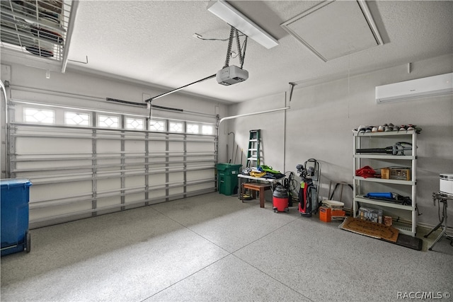 garage with a wall mounted AC and a garage door opener