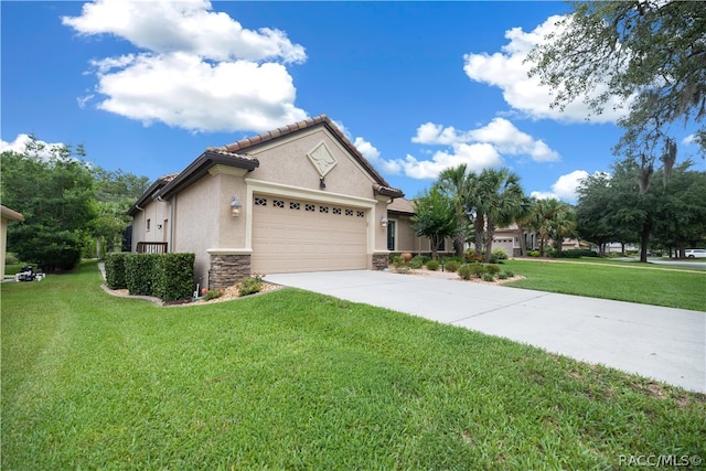 view of front of home featuring a front yard and a garage