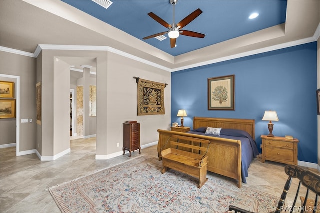 bedroom with a raised ceiling, ceiling fan, and ornamental molding