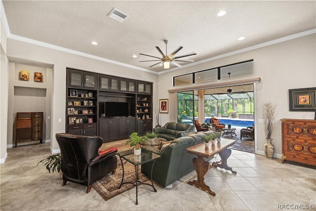 living room featuring ceiling fan, light tile patterned flooring, crown molding, and a textured ceiling