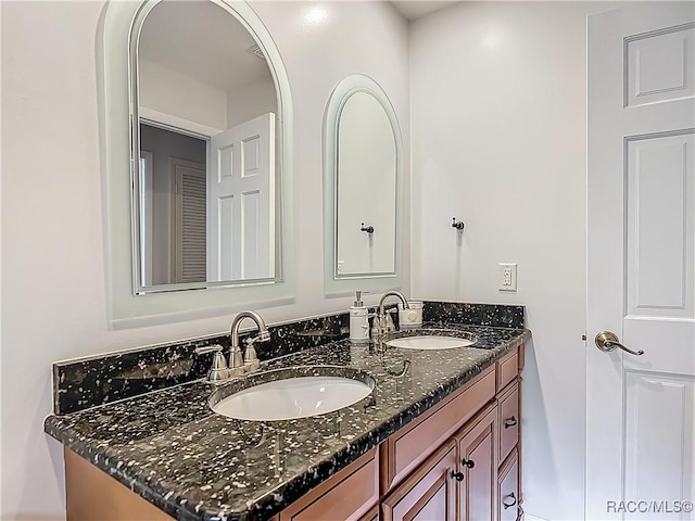bathroom featuring double vanity and a sink