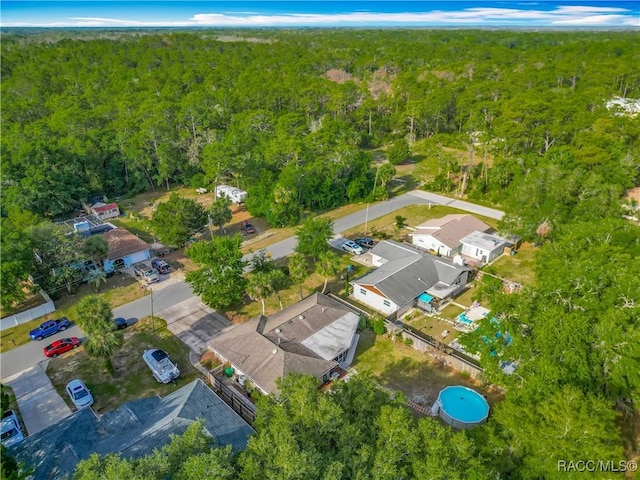 bird's eye view with a view of trees and a residential view