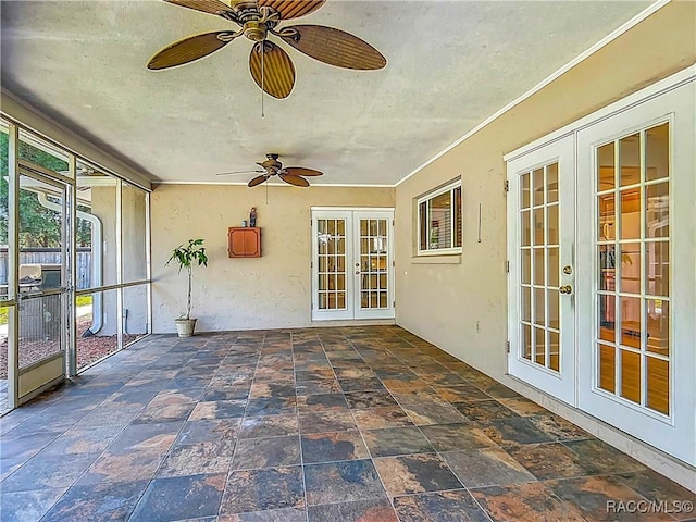 unfurnished sunroom featuring french doors
