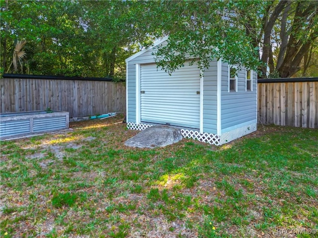 view of shed featuring a fenced backyard