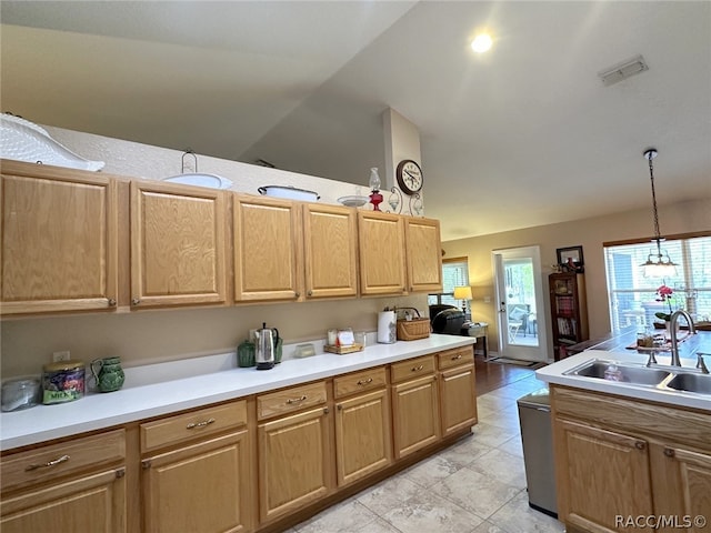 kitchen featuring sink, hanging light fixtures, an inviting chandelier, lofted ceiling, and light tile patterned flooring