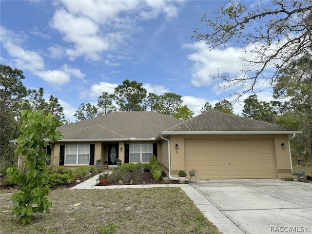 ranch-style house featuring a garage