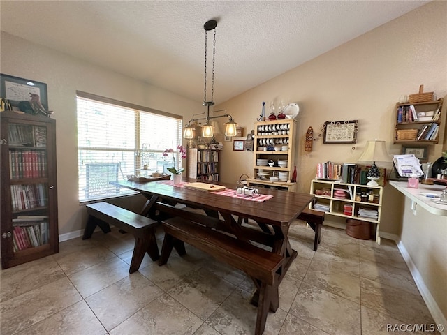 dining room featuring a textured ceiling