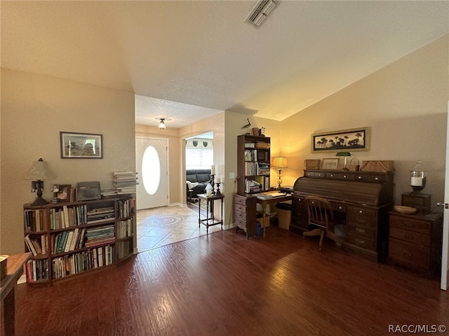 home office with hardwood / wood-style floors, a textured ceiling, and lofted ceiling