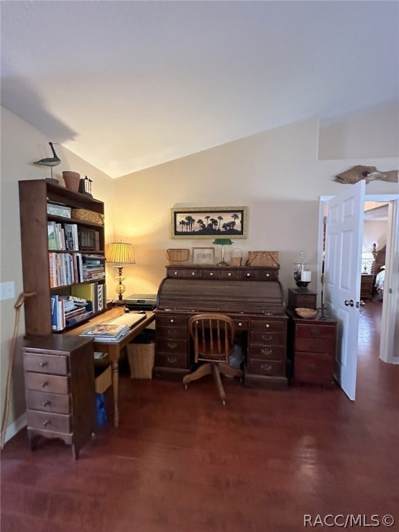 home office featuring lofted ceiling