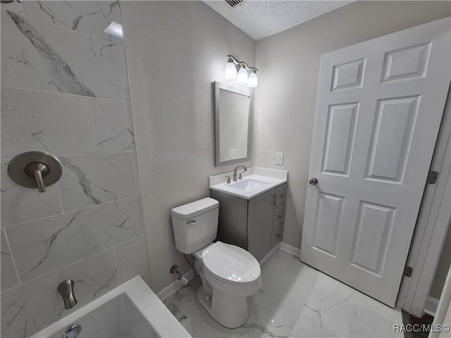 bathroom with toilet, vanity, and a textured ceiling