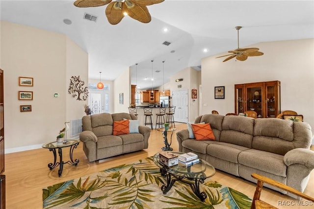2168 N Watersedge Dr, Crystal River, FL 34429 - living area with a ceiling fan, light wood-type flooring, and lofted ceiling