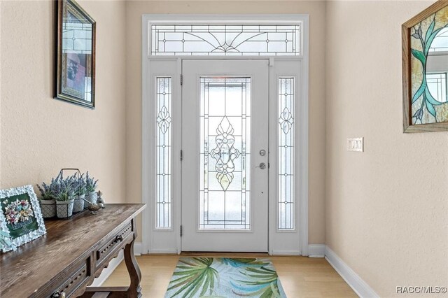 2168 N Watersedge Dr, Crystal River, FL 34429 - foyer entrance with light wood-style floors and a textured wall