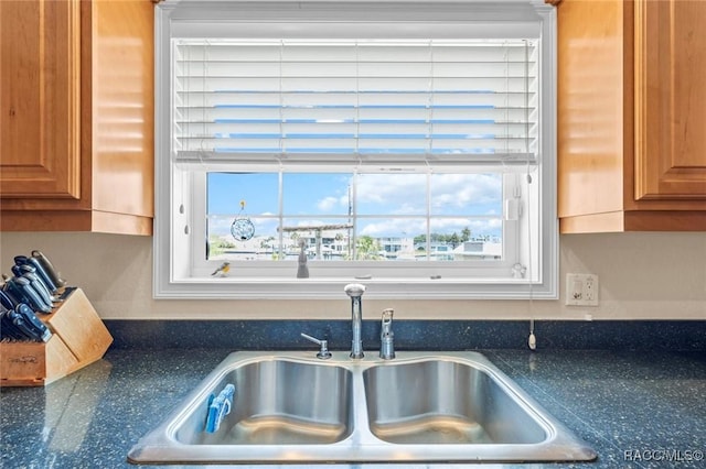 2168 N Watersedge Dr, Crystal River, FL 34429 - kitchen with brown cabinetry and dark stone countertops