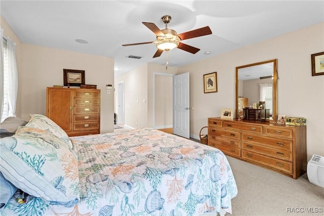 2168 N Watersedge Dr, Crystal River, FL 34429 - bedroom with light colored carpet and ceiling fan