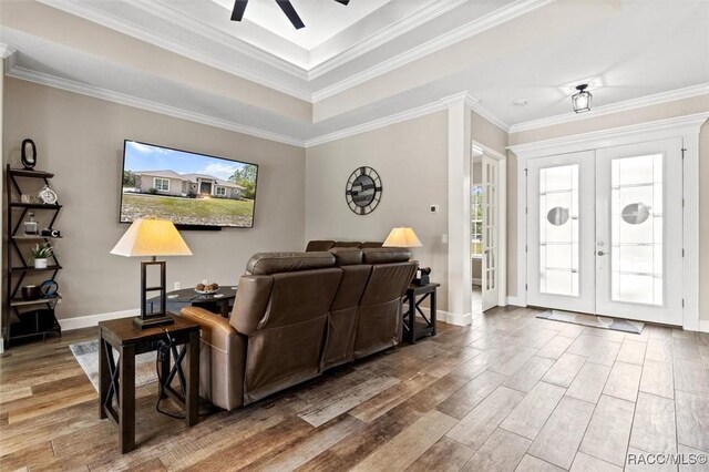 5888 W Corral Pl, Beverly Hills, FL 34465 - living area featuring wood finished floors, french doors, ceiling fan, baseboards, and ornamental molding