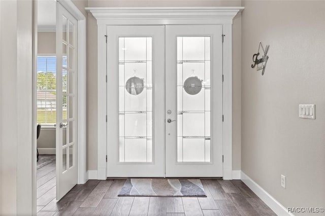 5888 W Corral Pl, Beverly Hills, FL 34465 - foyer with french doors, wood finished floors, and baseboards