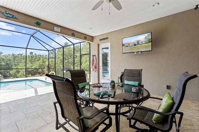 5888 W Corral Pl, Beverly Hills, FL 34465 - view of patio with a ceiling fan, outdoor dining area, a lanai, and an outdoor pool