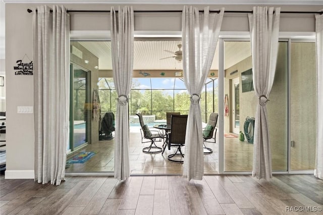 5888 W Corral Pl, Beverly Hills, FL 34465 - doorway to outside featuring hardwood / wood-style flooring and ceiling fan