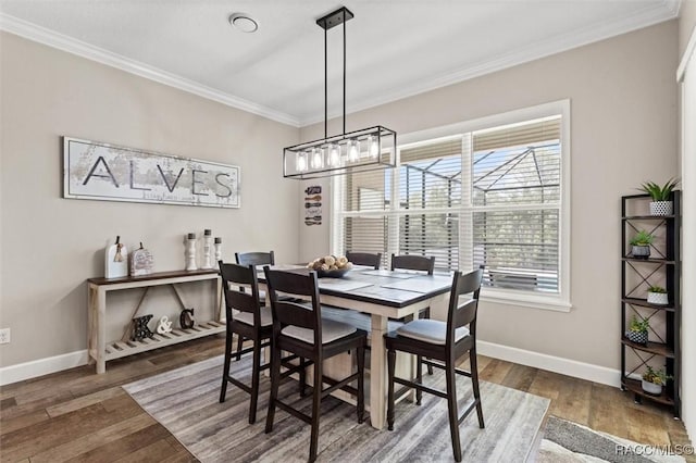 5888 W Corral Pl, Beverly Hills, FL 34465 - dining area featuring crown molding, baseboards, wood finished floors, and a chandelier