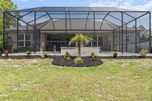 5888 W Corral Pl, Beverly Hills, FL 34465 - back of house with a yard and a lanai